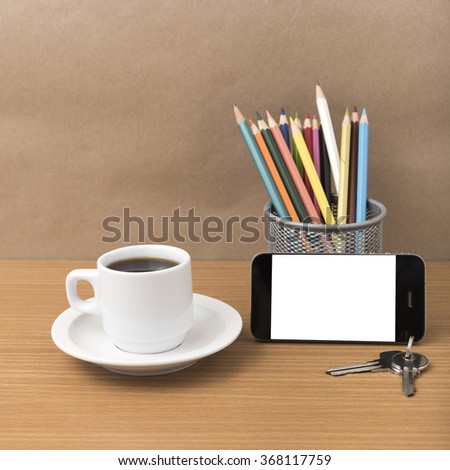 coffee,phone,key and pencil on wood table background