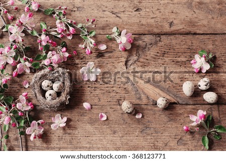 egg in nest with pink flowers