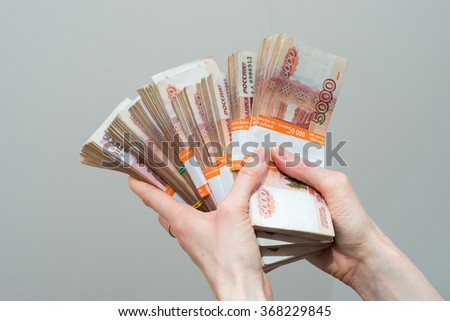 Russian banknotes rubles in hand Royalty-Free Stock Photo #368229845