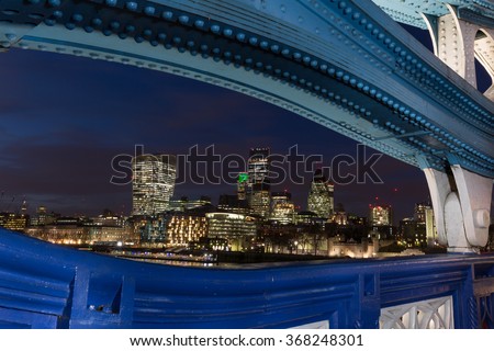 View from Tower Bridge in London at Night. Framed by the Tower Bridge Structure.