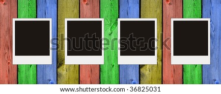 wooden background with blank photos