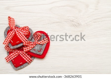 Valentines day background with red heart over wood