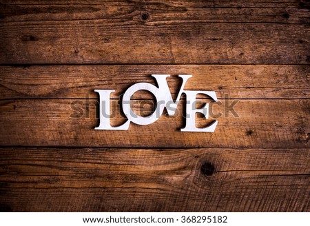Word ''love'' on a old wood planks. St. Valentine's Day