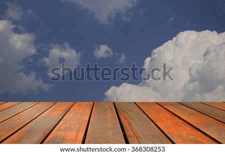 blurred image wood table and abstract blue sky background