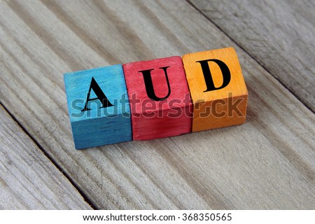AUD (Australian Dollar) sign on colorful wooden cubes