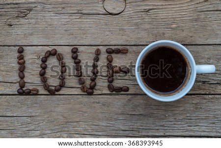 LOVE coffee beans on wooden background