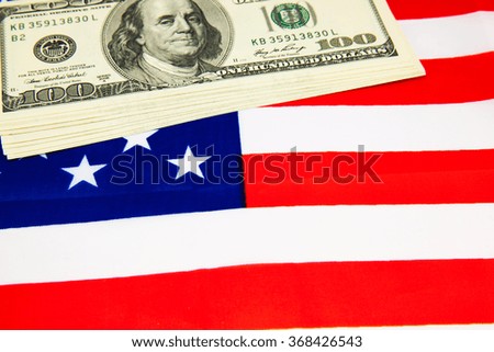 American dollars and flag. Stock images. Top.