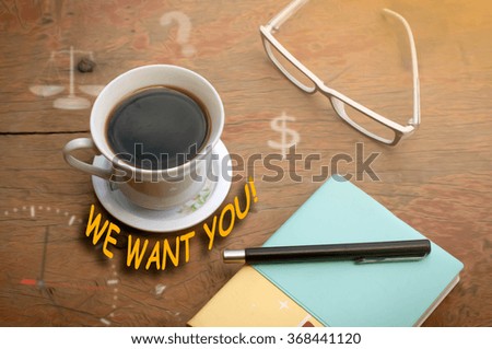 WE WANT YOU! message coffee cup and business strategy on wooden 