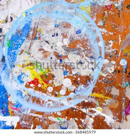 Abstract colorful texture background. Splash acrylic color on wood table.