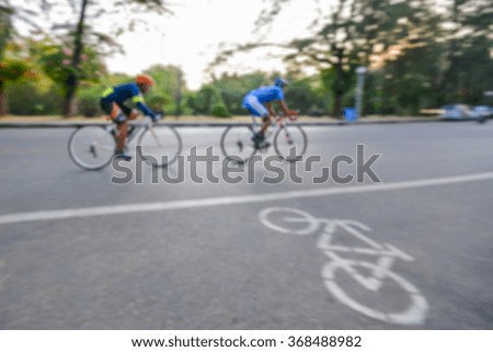 Exercise with cycling on the road. Blur photo