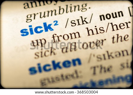 Close-up of word in English dictionary. Sick, definition and transcription