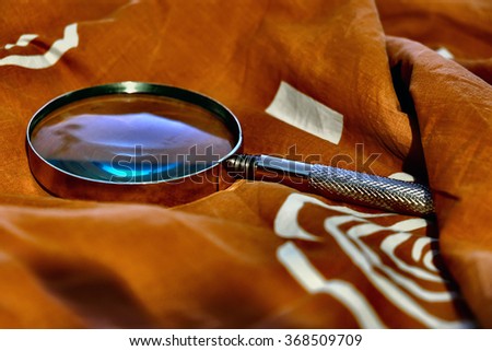 poor eyesight
magnifying glass against bright fabric