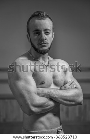 Photo of a man in the gym. Picture a man in a gym with exercise equipment.