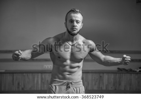 Photo of a man in the gym. Picture a man in a gym with exercise equipment.