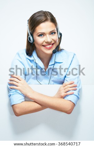 Woman operator with headset and blank sign board. Isolated portrait of smiling help line operator.
