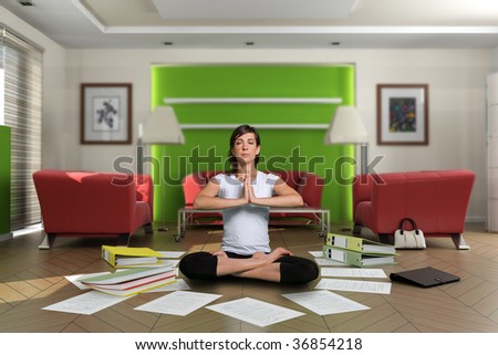 Woman in lotus pose in the middle of a chaotic living room with documents on the floor. The images on the pictures on the wall are mine, so no copyright issue.
