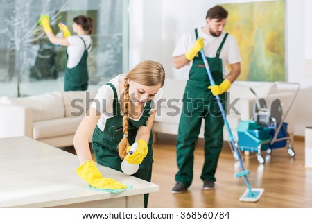 Cleaning service with professional equipment during work Royalty-Free Stock Photo #368560784