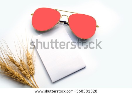 close up of  barley , notebook ,and glasses in composition in black and white