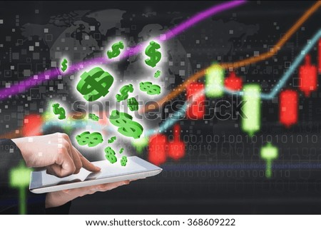 Business woman are checking stock market graph on digital tablet