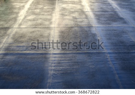 flame during welding of a waterproofing membrane on a roof Royalty-Free Stock Photo #368672822
