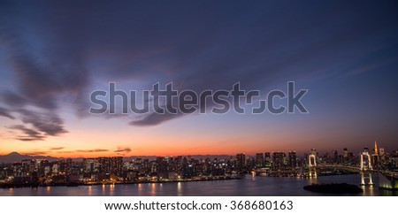 TOKYO cityscape at dusk with Rainbow bridge and Tokyo tower