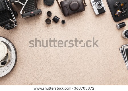 Photographer's desk, old cameras, traditional photography.