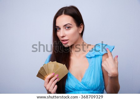 beautiful brunette smiling with bank cards