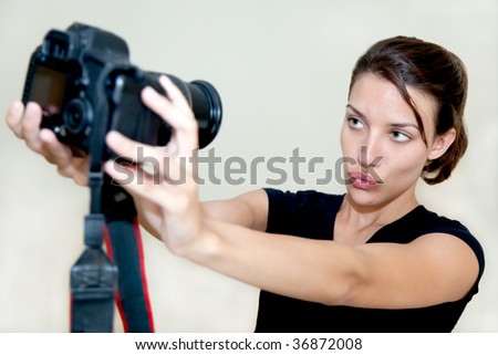A hispanic woman taking a picture of herself, isolated on a white background