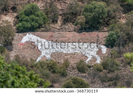 The White Horse on the east side of Naval Hill in Bloemfontein was built from rocks painted white, by British troops stationed in the area during the Anglo-Boer war, as a direction marker for troops Royalty-Free Stock Photo #368730119