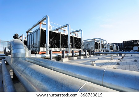 Sets of cooling towers in data center building. Royalty-Free Stock Photo #368730815
