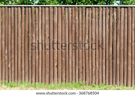 Solid wood picket fence background.