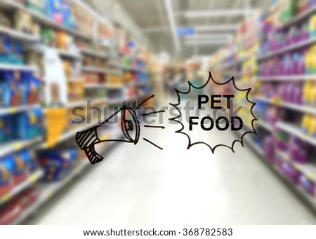 Blur image of pet food in super market with megaphone picture and message PET FOOD
