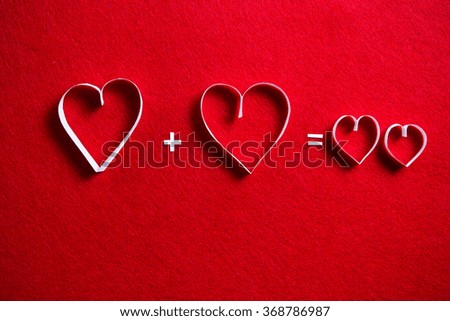 Paper hearts on red background for valentines day.