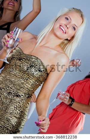 Image of happy friends looking at camera at party