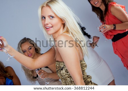 Image of happy friends looking at camera at party