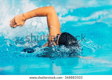 Freestyle swimming Royalty-Free Stock Photo #368883503