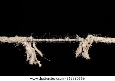 Rope about to break, a stress concept Royalty-Free Stock Photo #368890556