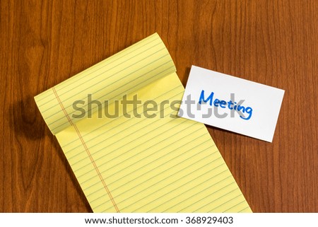 Meeting; White Blank Documents with Small Message Card.