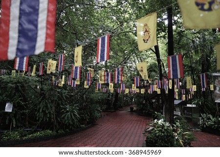 the Thai flag and the yellow flags of buddha