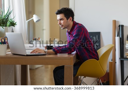 Architect working on a project Royalty-Free Stock Photo #368999813