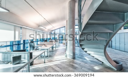 Interior of a company modern office. Royalty-Free Stock Photo #369009194