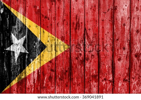 Flag of East Timor painted on wooden frame