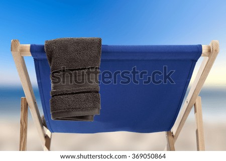 blurred background of coast and chair of summer 