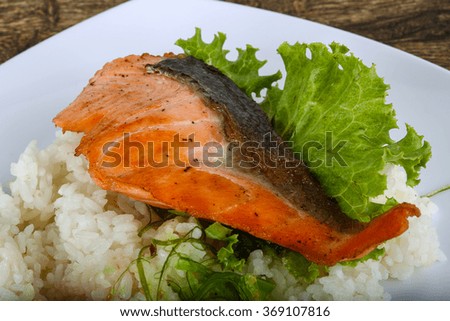 Roasted salmon steak with rice and herbs