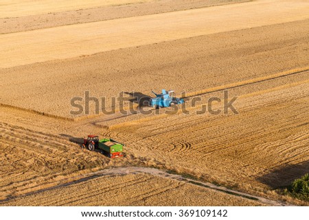 aerial view of combine on the harvest field in Poland