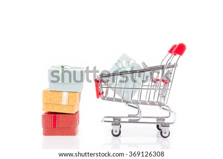colorful gifts box,supermarket shopping cart on white background