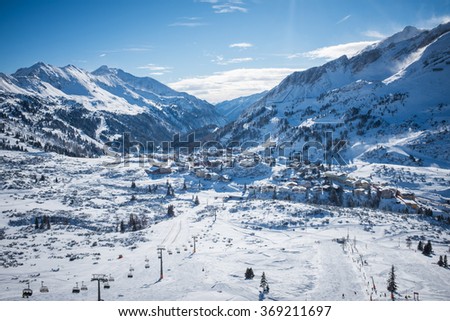 Color picture of a ski resort on a sunny day.