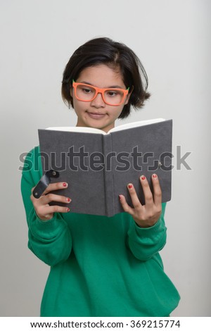 Nerd girl reading book