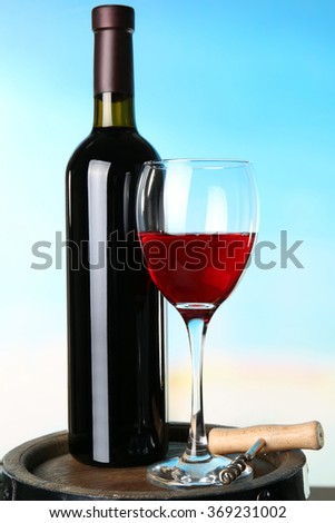 Wine on blurred natural background