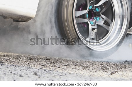 Racing Car Burnout  The picture is blurred